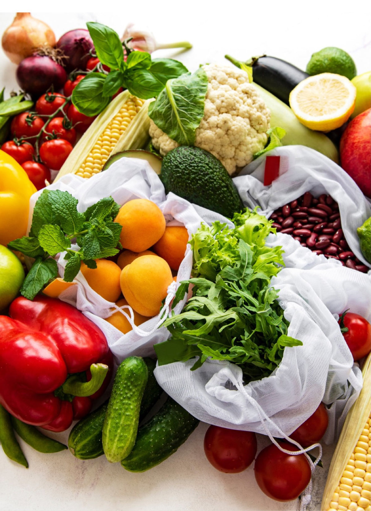A crate filled with fresh seasonal fruits and vegetables